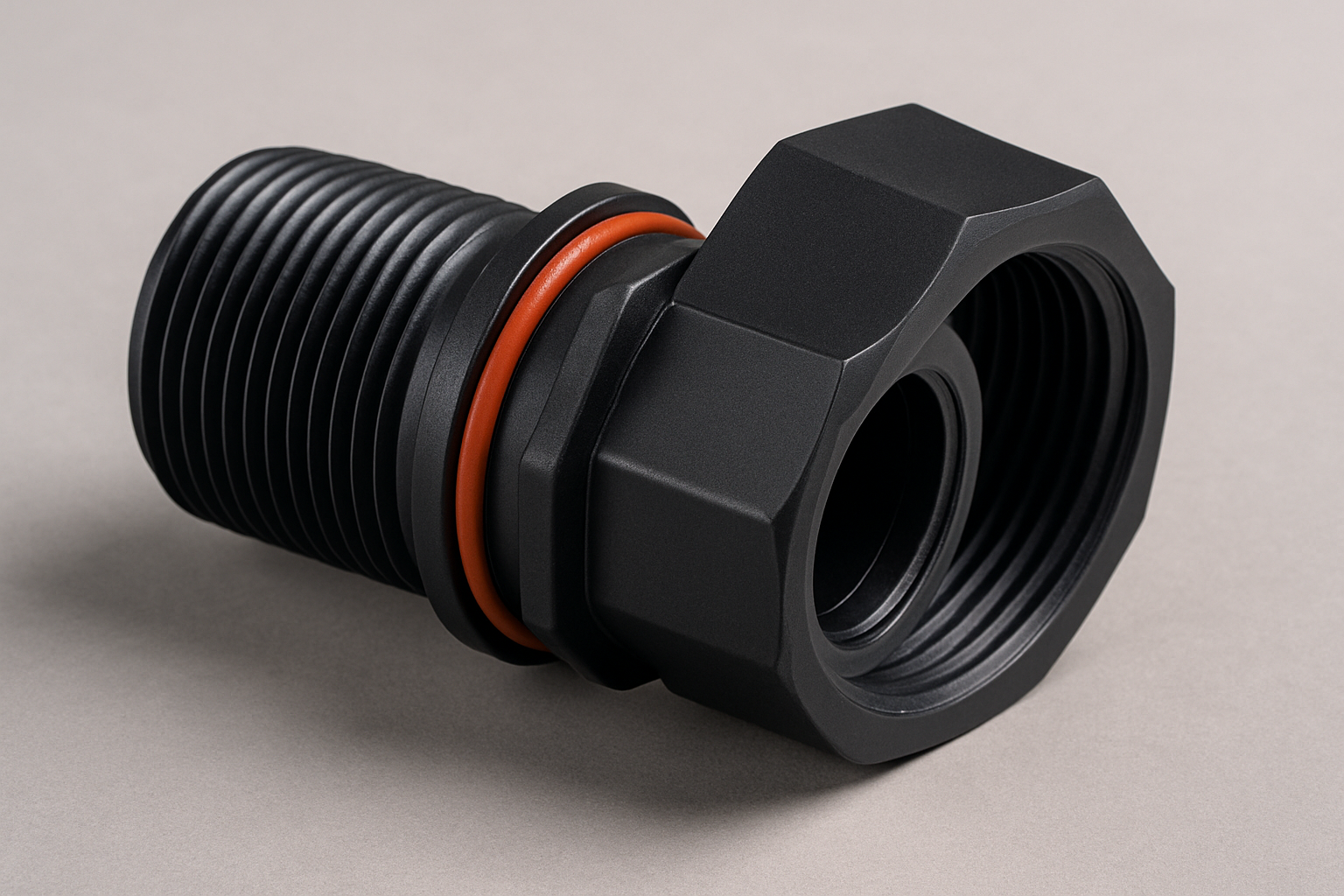 Precision plastic pipe fitting assembly with threaded end and gasket groove.
