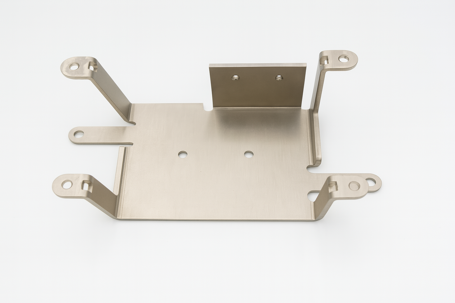 Stainless steel electronic mounting bracket with four extended arms and precision-cut holes, shown on a white backdrop.