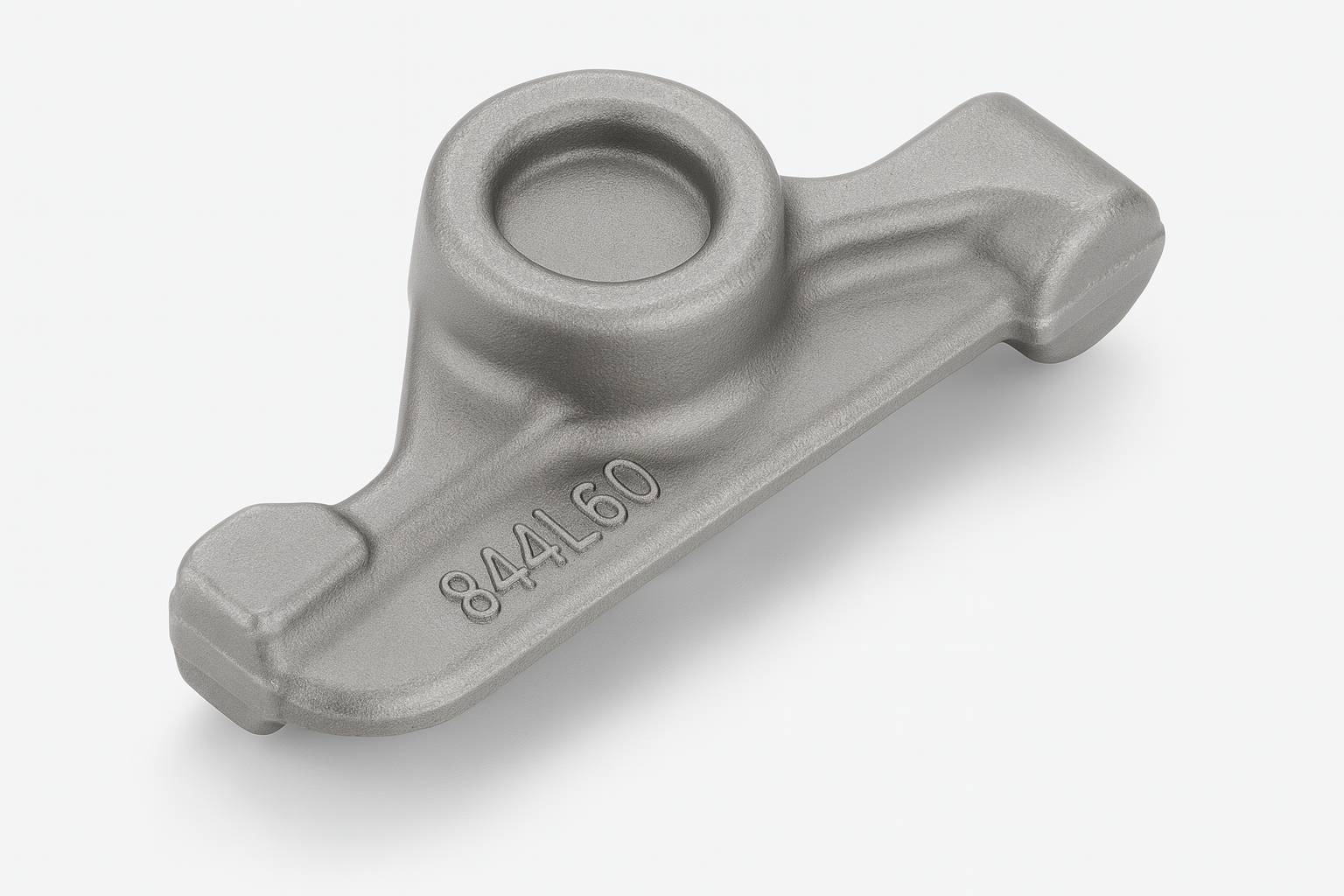 Cast iron rocker arm with a matte gray finish, featuring a central rounded cavity and clearly embossed part number, presented on a white surface with soft shadows.
