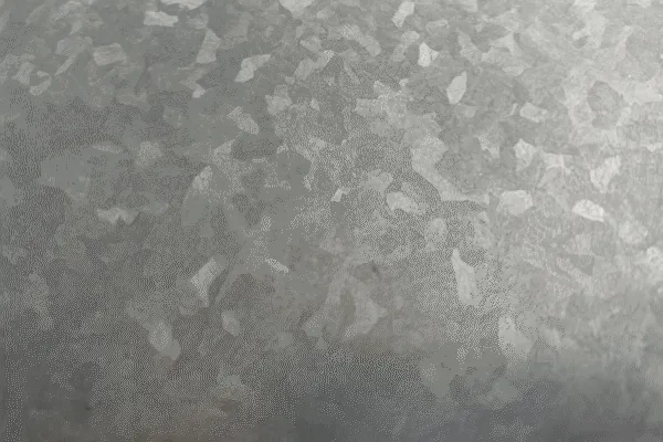 Close-up of a galvanized metal surface, showcasing the texture and coating.