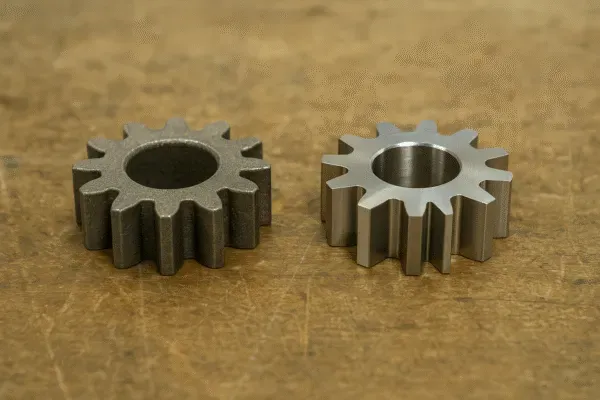 Comparison of two metal gears, showing one with a rougher finish and the other with a polished surface.