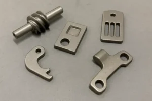 Close-up of various small metal parts, showcasing different shapes and precise manufacturing.