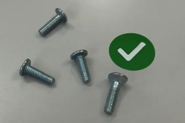 Approved metal fasteners with a green check mark, showing pass quality inspection for OEM hardware and assembly components.