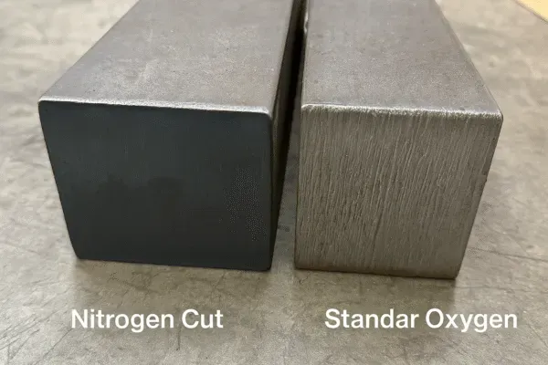 Comparison between nitrogen cut and standard oxygen cut metal parts showing different finishes.