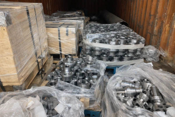 Pallets prepared for shipment with labeled cartons and protective wrapping.