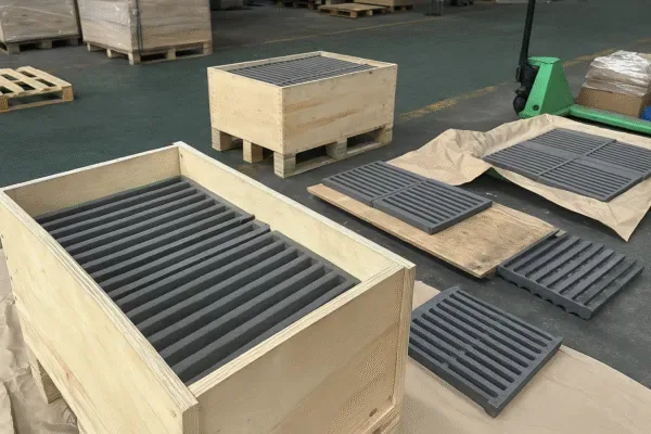Export logistics preparation for heat-resistant grate bar shipments in an industrial packaging area.